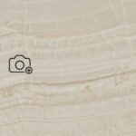 Beige Caesarstone surface with natural veining and the text ‘View in your room’